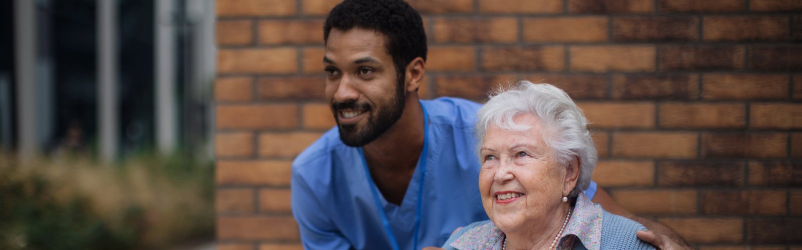 A man an elderly woman smiling